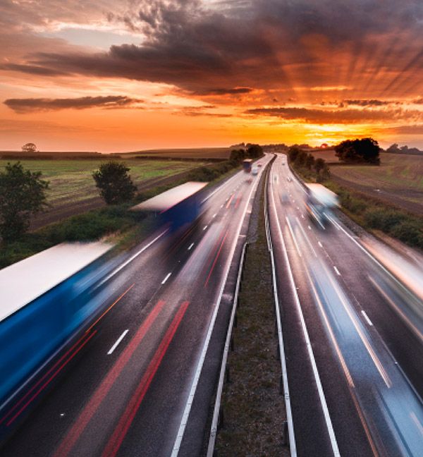 Motorway with lorries and cars blurred indicating movement for International services